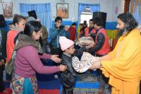 Distributing necessary materials to visually impaired students at Tamghas