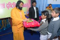 Distributing necessary materials to visually impaired students