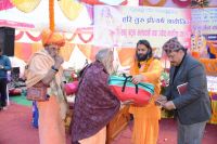 Distributing Necessary Materials to sadhus and batuks 