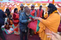 Distributing Necessary Materials to sadhus and batuks 