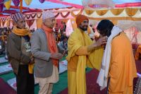 Distributing Necessary Materials to sadhus and batuks 